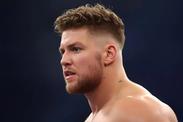 Wrestler having Curly Hair Taper Fade style